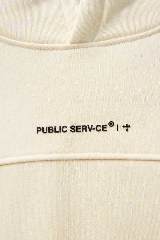 alt="detail of beige hoodie sweater front print"